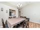 Charming dining space featuring hardwood floors, window and view to the kitchen at 1269 Frogs Leap, Cicero, IN 46034