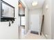 Welcoming home foyer with tiled flooring, a useful shelf with hooks, and a large Welcome sign at 1269 Frogs Leap, Cicero, IN 46034