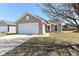 Charming single-Gathering home featuring a well-maintained lawn and attached two-car garage at 1269 Frogs Leap, Cicero, IN 46034