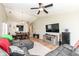 Bright and airy living space with hardwood floors, ceiling fan, and open layout to the dining area at 1269 Frogs Leap, Cicero, IN 46034