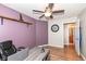 Purple office featuring a wood shelf, a desk, an office chair and wood-look floors at 1269 Frogs Leap, Cicero, IN 46034