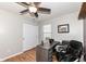 Office features a desk, a sleek black chair, wood-look floors, and a window at 1269 Frogs Leap, Cicero, IN 46034