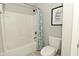Clean bathroom featuring a shower-tub combination and neutral decor at 1358 Rutherglen Ct, Danville, IN 46122