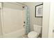 Clean, white bathroom featuring a shower with curtain and a standard toilet at 1358 Rutherglen Ct, Danville, IN 46122