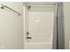 Clean and well-maintained bathtub with a shower head and gray shower curtain at 1358 Rutherglen Ct, Danville, IN 46122