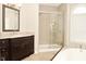 Bathroom with double sink vanity, walk-in shower, and a soaking tub at 1358 Rutherglen Ct, Danville, IN 46122