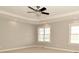 Spacious bedroom with neutral tones, recessed lighting, and large windows at 1358 Rutherglen Ct, Danville, IN 46122
