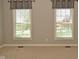 Cozy bedroom with neutral walls, carpet, and dual windows for ample natural light at 1358 Rutherglen Ct, Danville, IN 46122