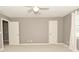 Neutral bedroom featuring a carpeted floor, natural light, and standard closets at 1358 Rutherglen Ct, Danville, IN 46122