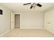 A neutral bedroom with carpet features two closets and two entry doors at 1358 Rutherglen Ct, Danville, IN 46122