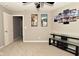 Well-lit bedroom featuring neutral colors, carpeted floors, and open door at 1358 Rutherglen Ct, Danville, IN 46122