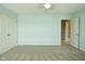 Inviting bedroom with a ceiling fan, soft colors, and access to a doorway, offering comfort and style at 1358 Rutherglen Ct, Danville, IN 46122