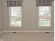 Minimalist bedroom featuring neutral tones and windows with natural light at 1358 Rutherglen Ct, Danville, IN 46122