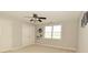 A sports-themed bedroom with a ceiling fan features a 'Colts' wall decal and carpeted floor at 1358 Rutherglen Ct, Danville, IN 46122
