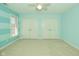 Bedroom with blue horizontal striped walls and carpeted floors at 1358 Rutherglen Ct, Danville, IN 46122