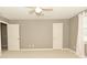 Bedroom features neutral walls and carpet, a window with curtains, and a ceiling fan at 1358 Rutherglen Ct, Danville, IN 46122