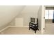 Upstairs bonus area with sloped ceilings and natural light, great for media or hobby space at 1358 Rutherglen Ct, Danville, IN 46122