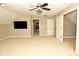 Large bonus room with neutral carpet, tv and doors at 1358 Rutherglen Ct, Danville, IN 46122