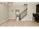 Bright dining area with tile floors and staircase at 1358 Rutherglen Ct, Danville, IN 46122