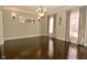 Spacious dining room featuring hardwood floors, a chandelier and abundant natural light at 1358 Rutherglen Ct, Danville, IN 46122