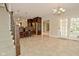 Open layout with a dining area, kitchen bar with stools, and view to a backyard at 1358 Rutherglen Ct, Danville, IN 46122