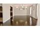 Dining room featuring hardwood floors, chandelier, and gray walls at 1358 Rutherglen Ct, Danville, IN 46122