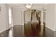 Welcoming foyer with hardwood floors, staircase, and arched entryway creates an elegant first impression at 1358 Rutherglen Ct, Danville, IN 46122