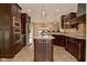 Beautiful kitchen with dark wood cabinetry, stainless steel appliances, and a functional center island at 1358 Rutherglen Ct, Danville, IN 46122