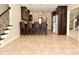 Spacious kitchen with dark cabinets, stainless steel appliances, and a bar with seating at 1358 Rutherglen Ct, Danville, IN 46122