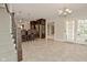 Open floor plan featuring a kitchen, bar with stools and access to the outdoors at 1358 Rutherglen Ct, Danville, IN 46122