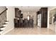 Open floor plan featuring a kitchen bar with stools and stainless steel appliances at 1358 Rutherglen Ct, Danville, IN 46122
