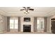 Large living room featuring a fireplace with a TV, recessed lighting, and elegant curtains at 1358 Rutherglen Ct, Danville, IN 46122