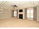 Spacious living room with plush carpeting, a fireplace, and large windows at 1358 Rutherglen Ct, Danville, IN 46122