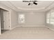 Spacious bedroom with neutral paint, tray ceiling, recessed lighting, and large windows at 1358 Rutherglen Ct, Danville, IN 46122