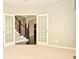 Open office with staircase views, french doors, carpeted flooring and natural light at 1358 Rutherglen Ct, Danville, IN 46122