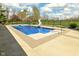 Inviting in-ground pool with a slide, surrounded by lush landscaping and a secure black fence at 1358 Rutherglen Ct, Danville, IN 46122