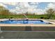 Relax by the sparkling in-ground pool with a slide, diving board, and lush green surroundings at 1358 Rutherglen Ct, Danville, IN 46122