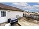 Cozy back deck featuring a grill, seating, and a partially shaded area for outdoor enjoyment at 1378 Millridge Dr, Greenwood, IN 46143