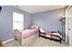 Bedroom with carpet floors and two single beds near the window at 1378 Millridge Dr, Greenwood, IN 46143