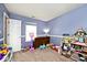Playful ' room with carpet floors, a dollhouse, toys, and bright window at 1378 Millridge Dr, Greenwood, IN 46143