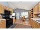 Eat-in kitchen with modern appliances, oak cabinets, lots of natural light, and an adjacent dining area at 1378 Millridge Dr, Greenwood, IN 46143