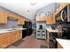 Functional kitchen featuring neutral countertops, oak cabinets, modern appliances and decorative accents at 1378 Millridge Dr, Greenwood, IN 46143