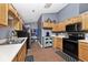 Fully-equipped kitchen boasts ample cabinetry, modern appliances, and stylish black and white patterned floor mats at 1378 Millridge Dr, Greenwood, IN 46143