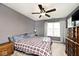 Primary bedroom featuring a fan, dresser, closet, and neutral paint at 1378 Millridge Dr, Greenwood, IN 46143