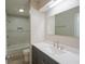 Modern bathroom with a tiled shower, and a vanity with ample storage space at 1509 E Centennial Ave, Muncie, IN 47303
