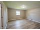 Bedroom featuring a large window, neutral color scheme, and wood-look flooring at 1509 E Centennial Ave, Muncie, IN 47303