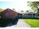 Cozy brick home with a covered porch and a narrow walkway in a charming neighborhood at 1509 E Centennial Ave, Muncie, IN 47303