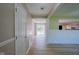 Bright hallway featuring durable wood-look flooring with access to the backyard at 1509 E Centennial Ave, Muncie, IN 47303