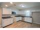Well-equipped kitchen features white cabinets, stainless steel appliances, and modern countertops at 1509 E Centennial Ave, Muncie, IN 47303