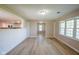 Open-concept living room has great natural light and wood-look floors throughout at 1509 E Centennial Ave, Muncie, IN 47303